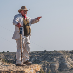 Theodore Roosevelt reprisor Joe Wiegand leads a guided hike in Medora, ND near Teddy Roosevelt National Park.