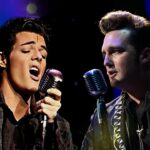 Two actors portraying Elvis Presley and Johnny Cash sing into microphones during Cash vs The King, a show playing in Medora, North Dakota