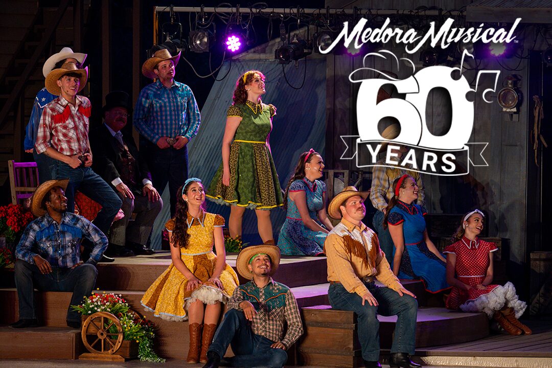Burning Hills Singers singing together in the Medora Musical in Medora, ND. Includes Medora Musical 60th anniversary logo.