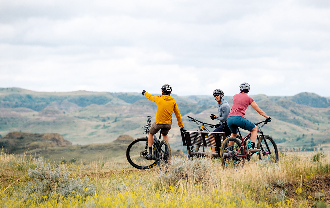 three men biking on the trails in Medora badlands