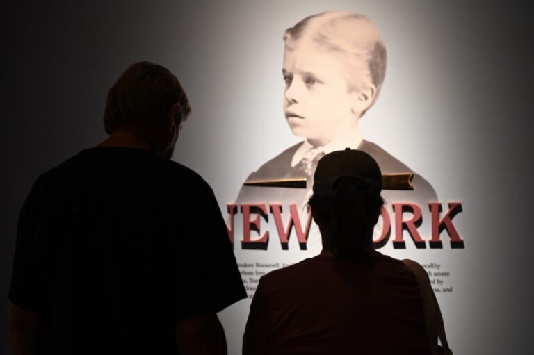 A man and woman take in a history lesson.